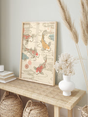 Three Koi fish, two pink and one orange, swimming in swirling water with blue and pink, in an alternate framed mockup