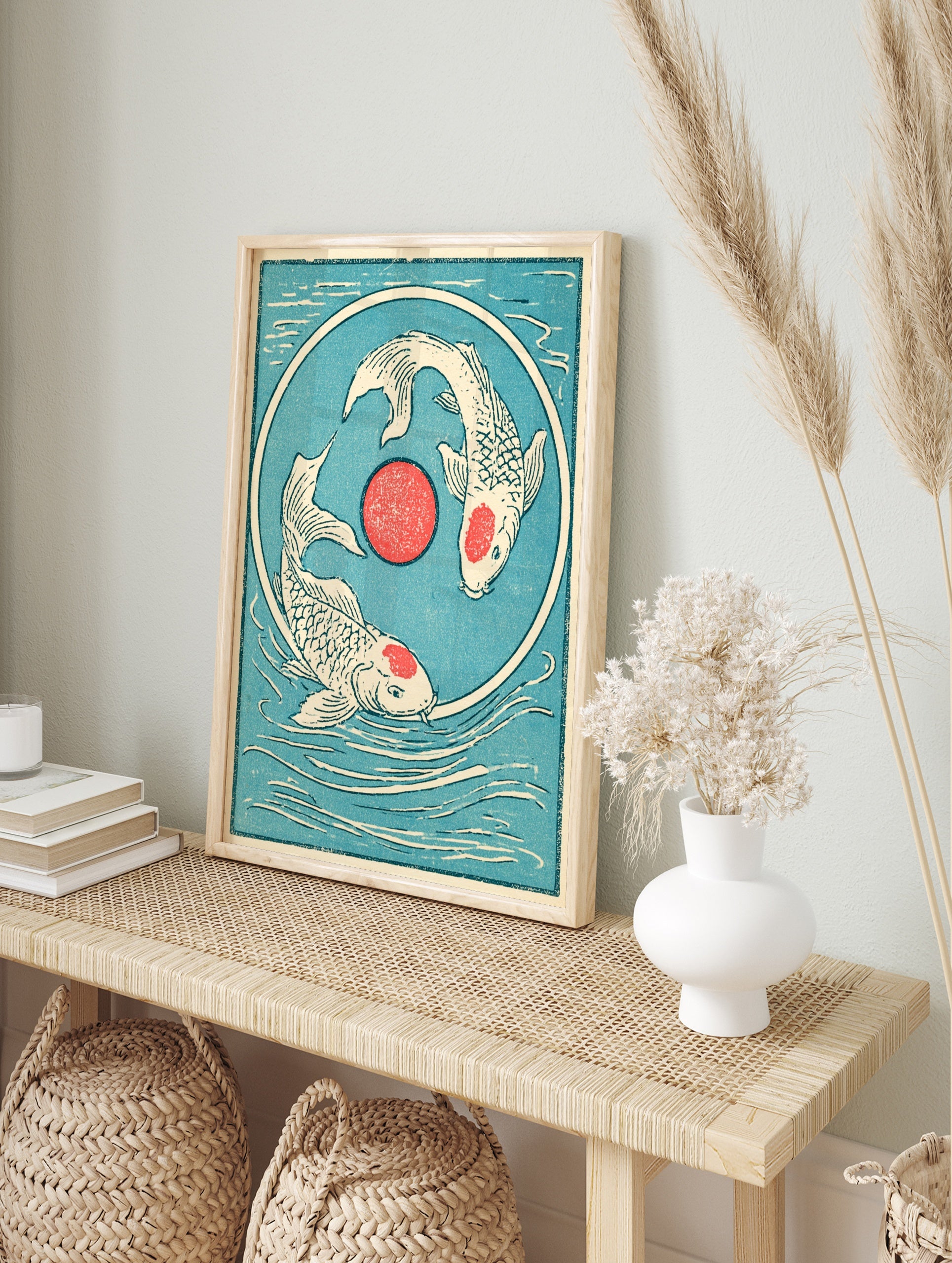 Japanese style koi fish wall art with two fish swimming in a circle around a red sun on a, in an alternate framed mockup