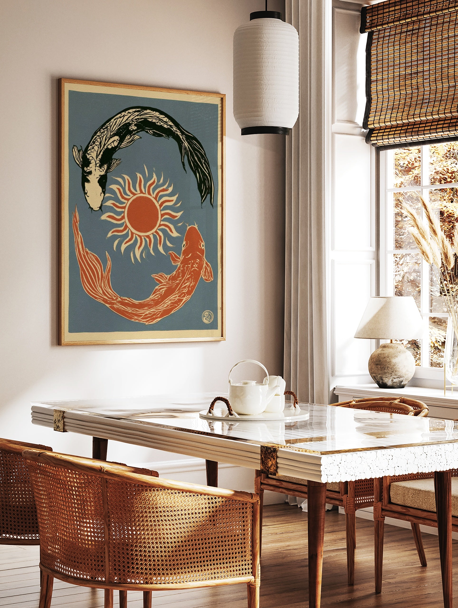 Illustrative koi fish wall art print with a sun symbol on a blue background, in a styled room mockup