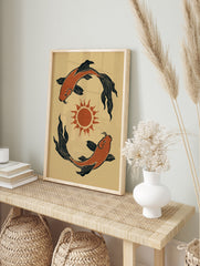 Illustrative koi fish wall art with two fish circling a central sun in orange and black on a, in an alternate framed mockup
