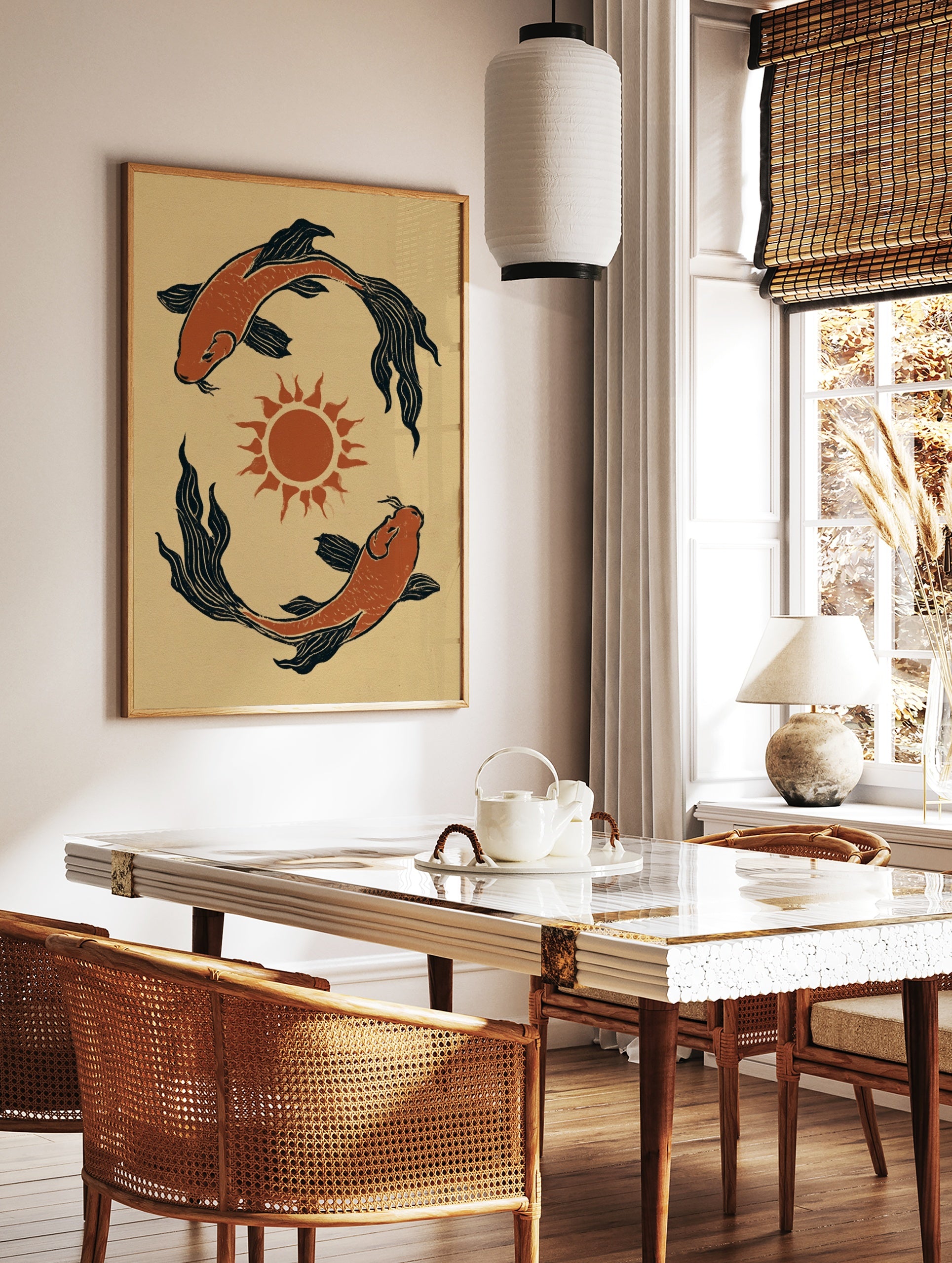 Illustrative koi fish wall art with two fish circling a central sun in orange and black on a, in a styled room mockup