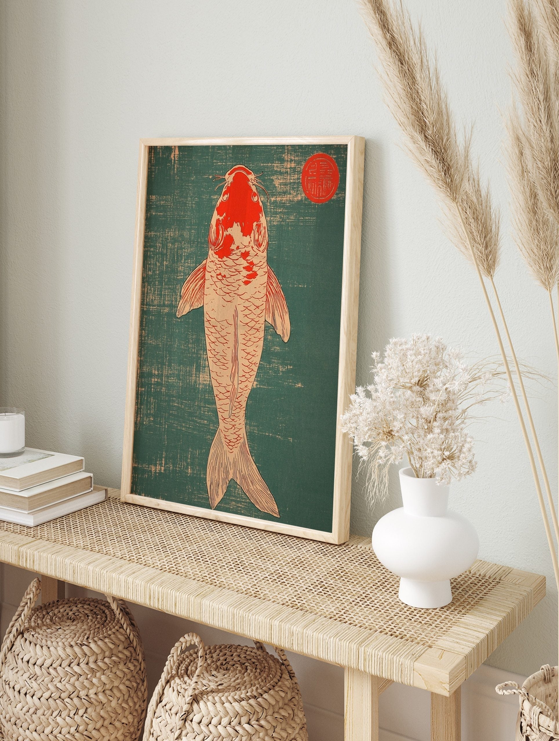 Top-down view of a red and off-white Koi fish against a teal textured background with a red, in an alternate framed mockup