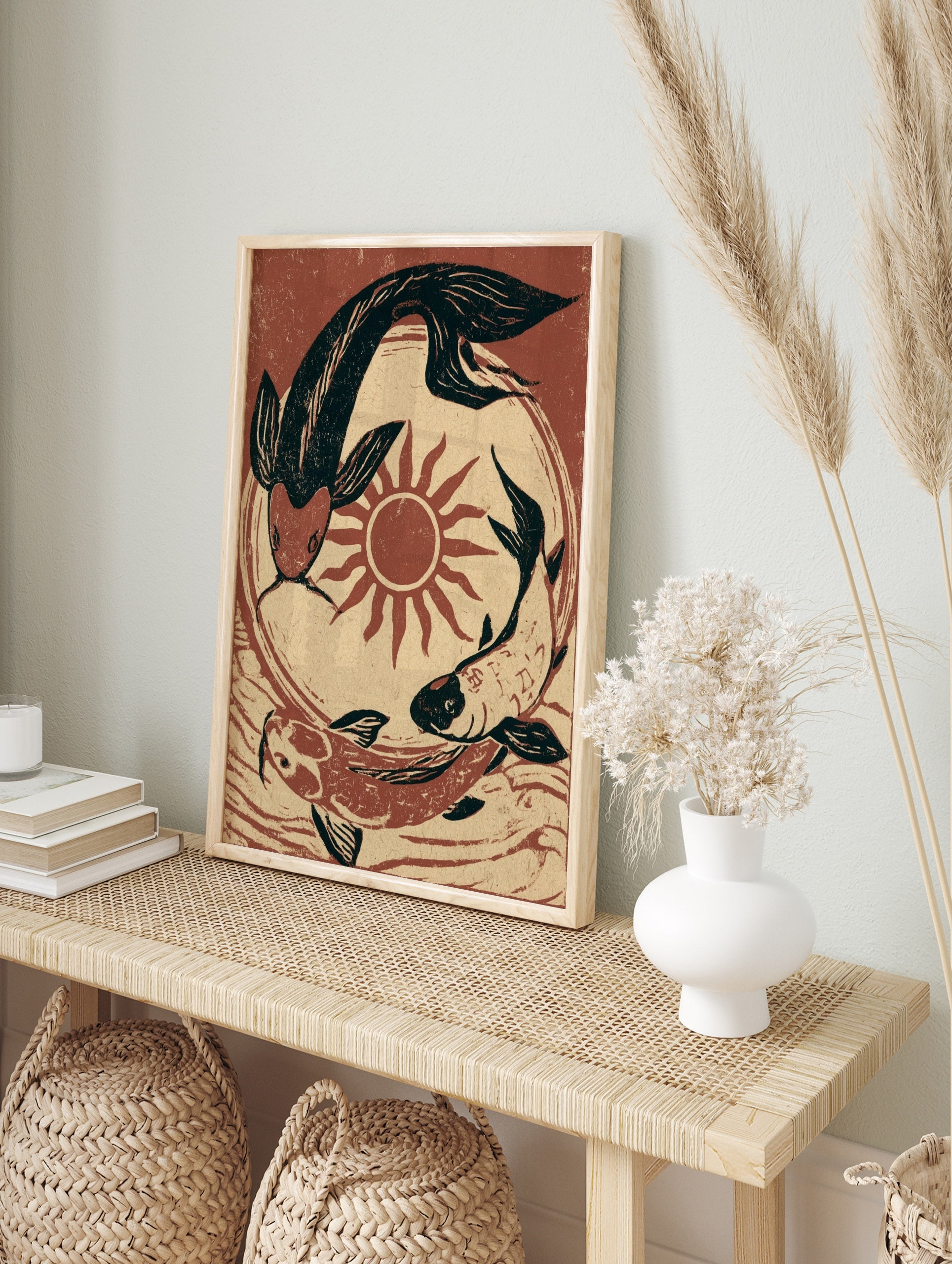 Koi fish wall art featuring three fish circling a red sun in a black and terracotta, in an alternate framed mockup