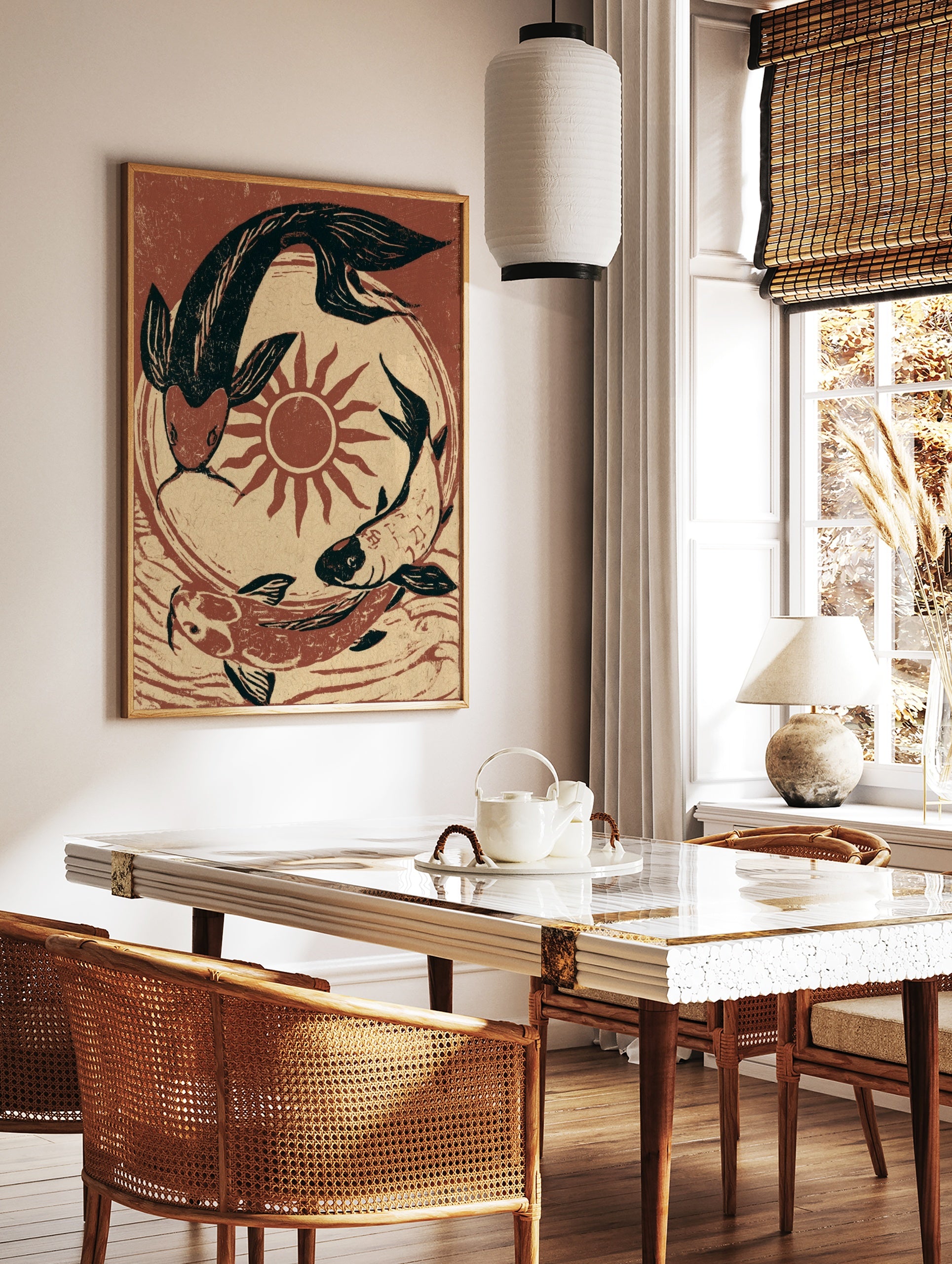 Koi fish wall art featuring three fish circling a red sun in a black and terracotta illustrative, in a styled room mockup