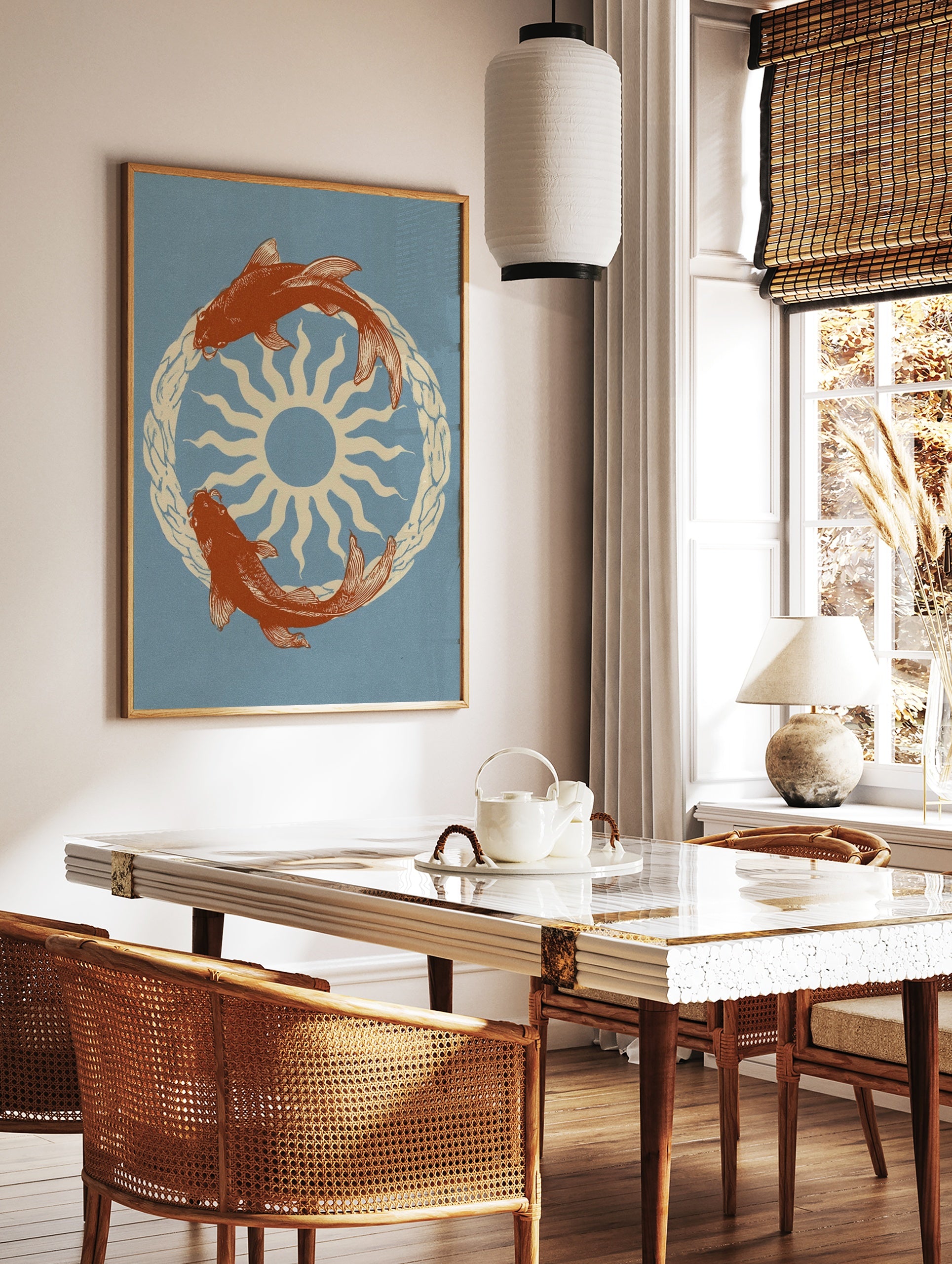 Illustrative koi fish swimming in a circle around a central sun, cream and orange on dusty blue, in a styled room mockup