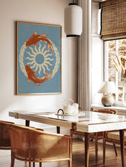 Illustrative koi fish swimming in a circle around a central sun, cream and orange on dusty blue, in a styled room mockup