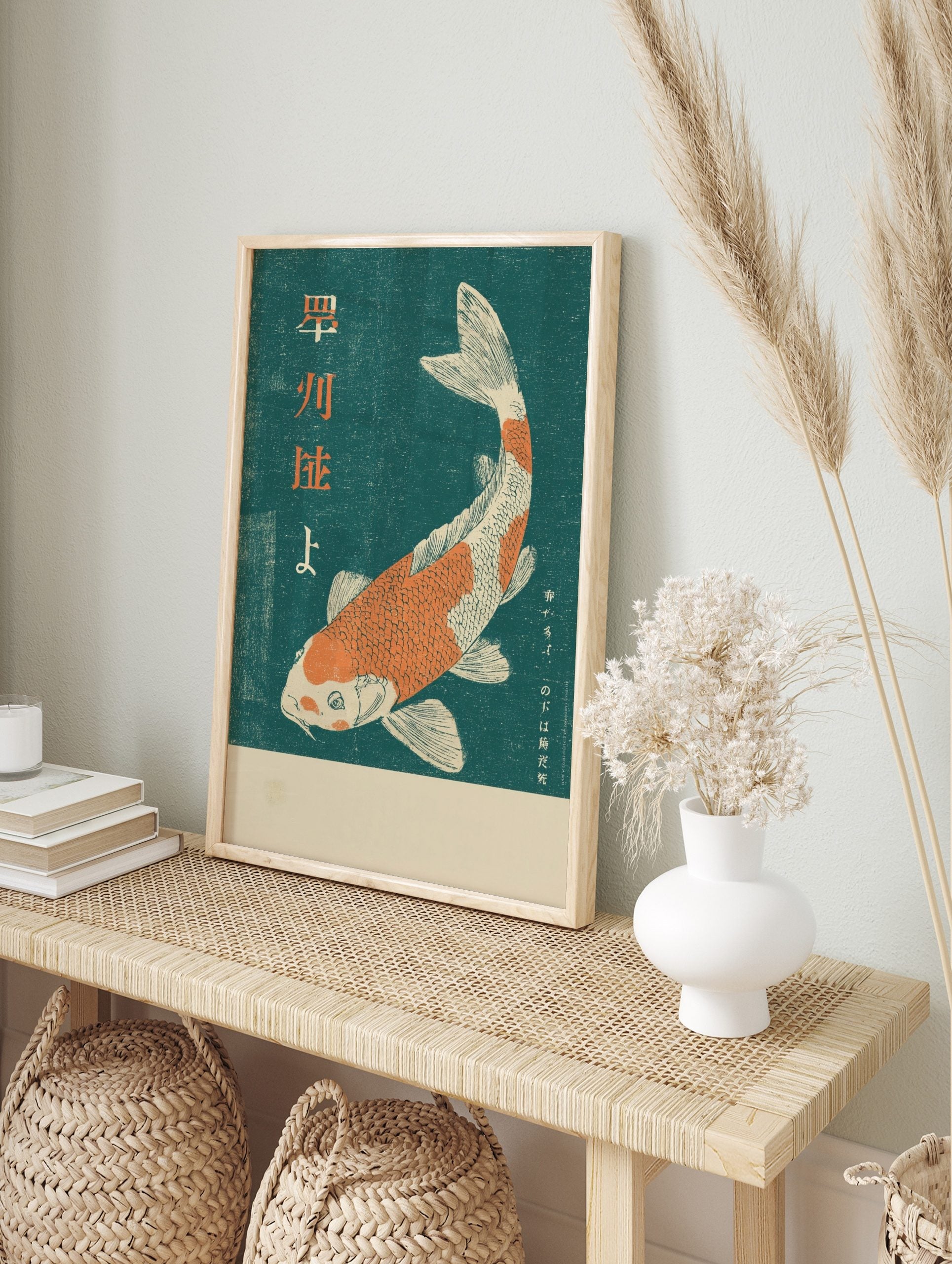 Orange and white koi fish woodblock print with Japanese Kanji text on a deep teal background, in an alternate framed mockup