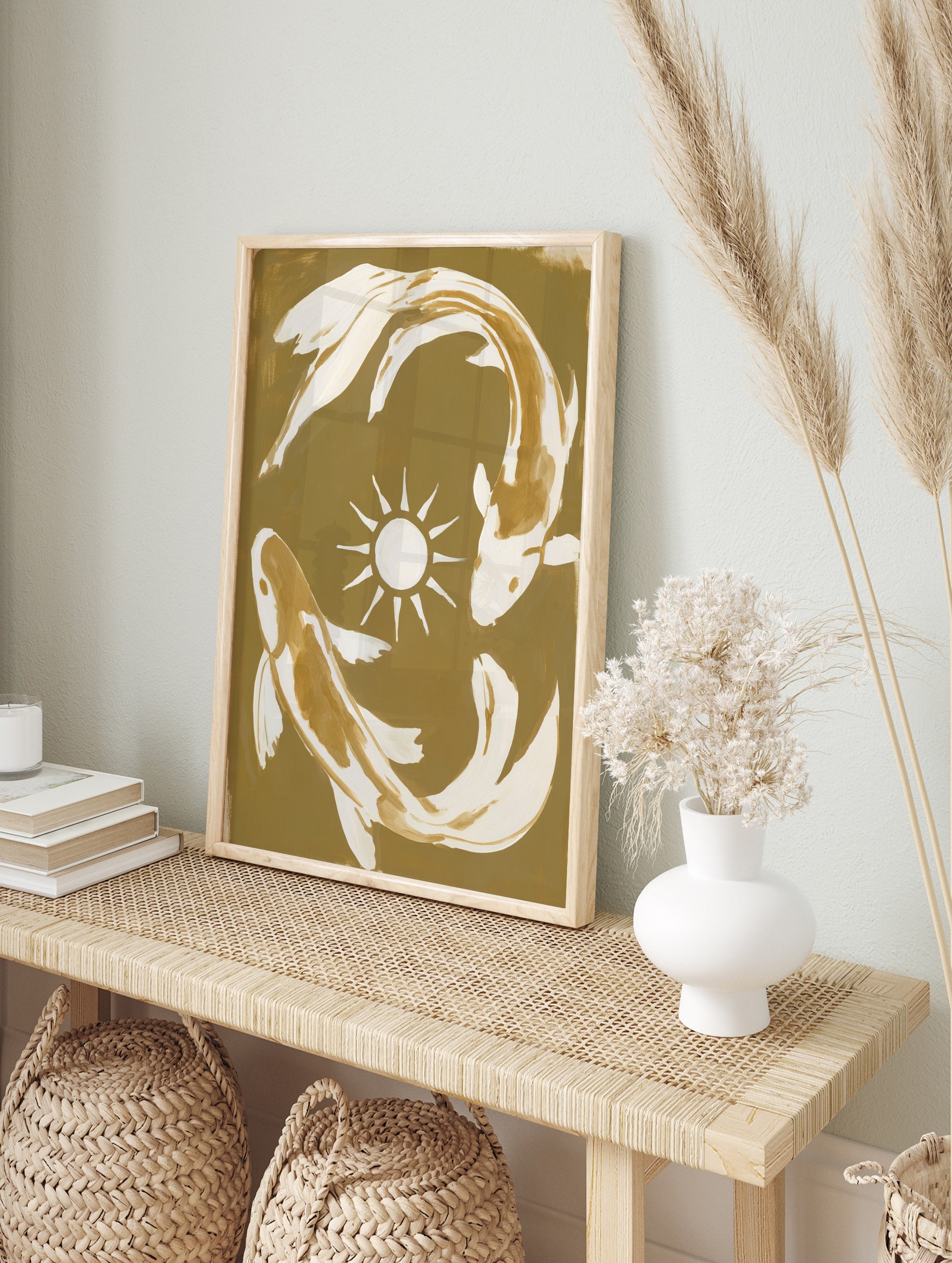 Koi fish wall art featuring two fish in a circular motion around a sun symbol on a tan and, in an alternate framed mockup