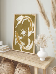 Koi fish wall art featuring two fish in a circular motion around a sun symbol on a tan and, in an alternate framed mockup