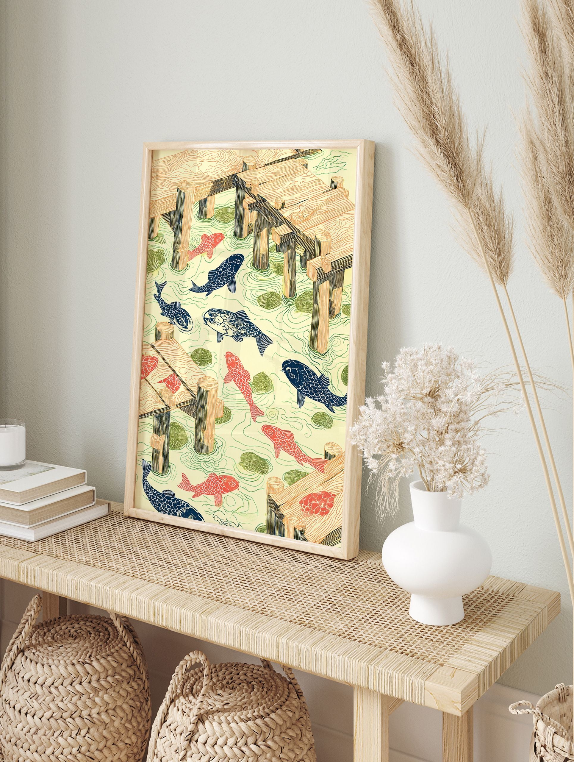 Woodcut style Koi Pond Wall Art with orange and blue fish, green lily pads, and wooden docks in light yellow water. - Image 3