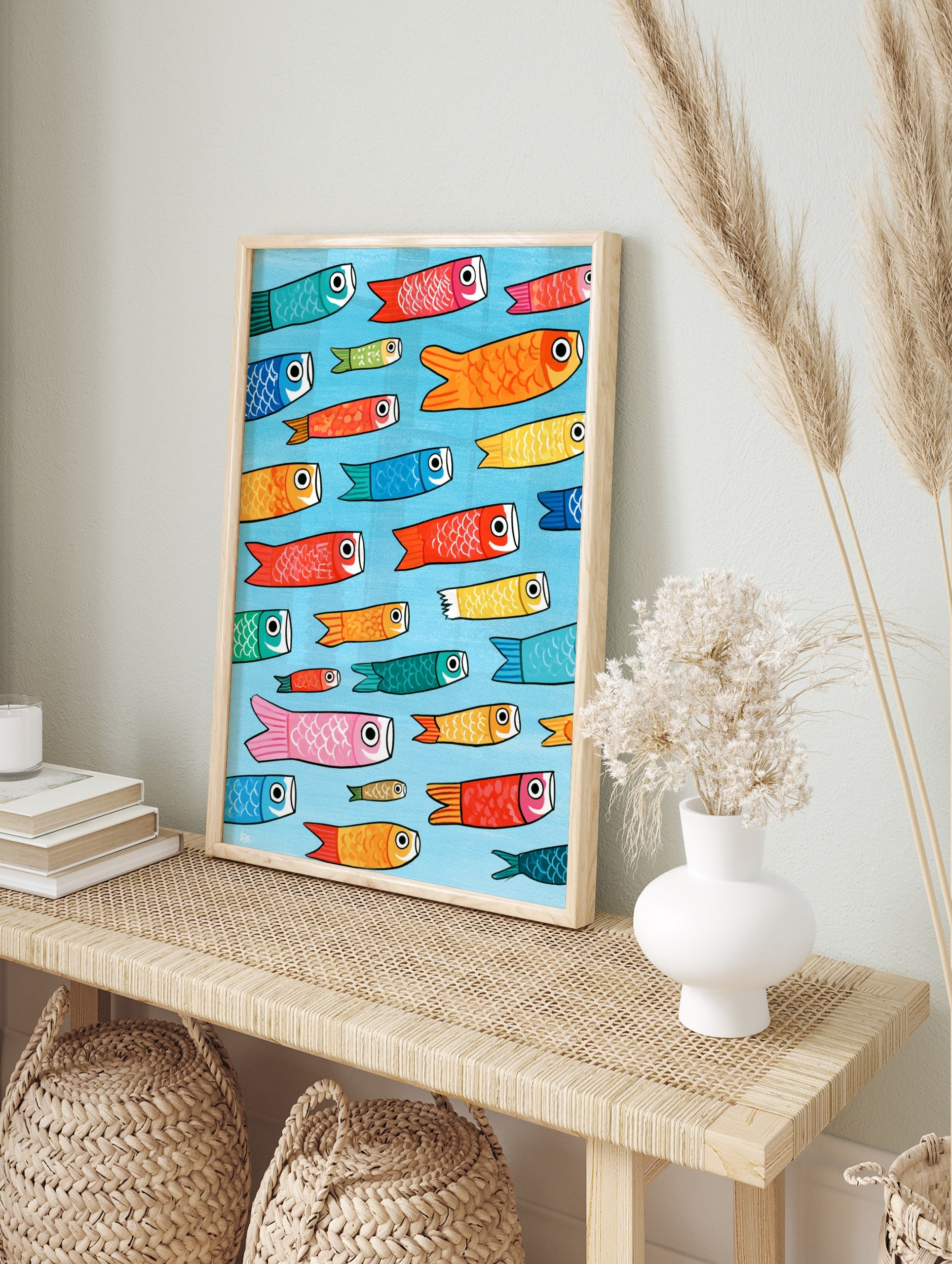 Pattern of colourful Japanese Koinobori carp streamers on a light blue background, in an alternate framed mockup