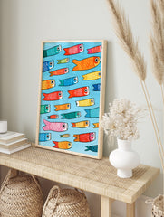 Pattern of colourful Japanese Koinobori carp streamers on a light blue background, in an alternate framed mockup
