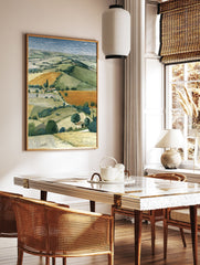 Illustrated landscape art print depicting rolling green and orange farm fields, scattered trees, and houses under a blue sky. - Image 2