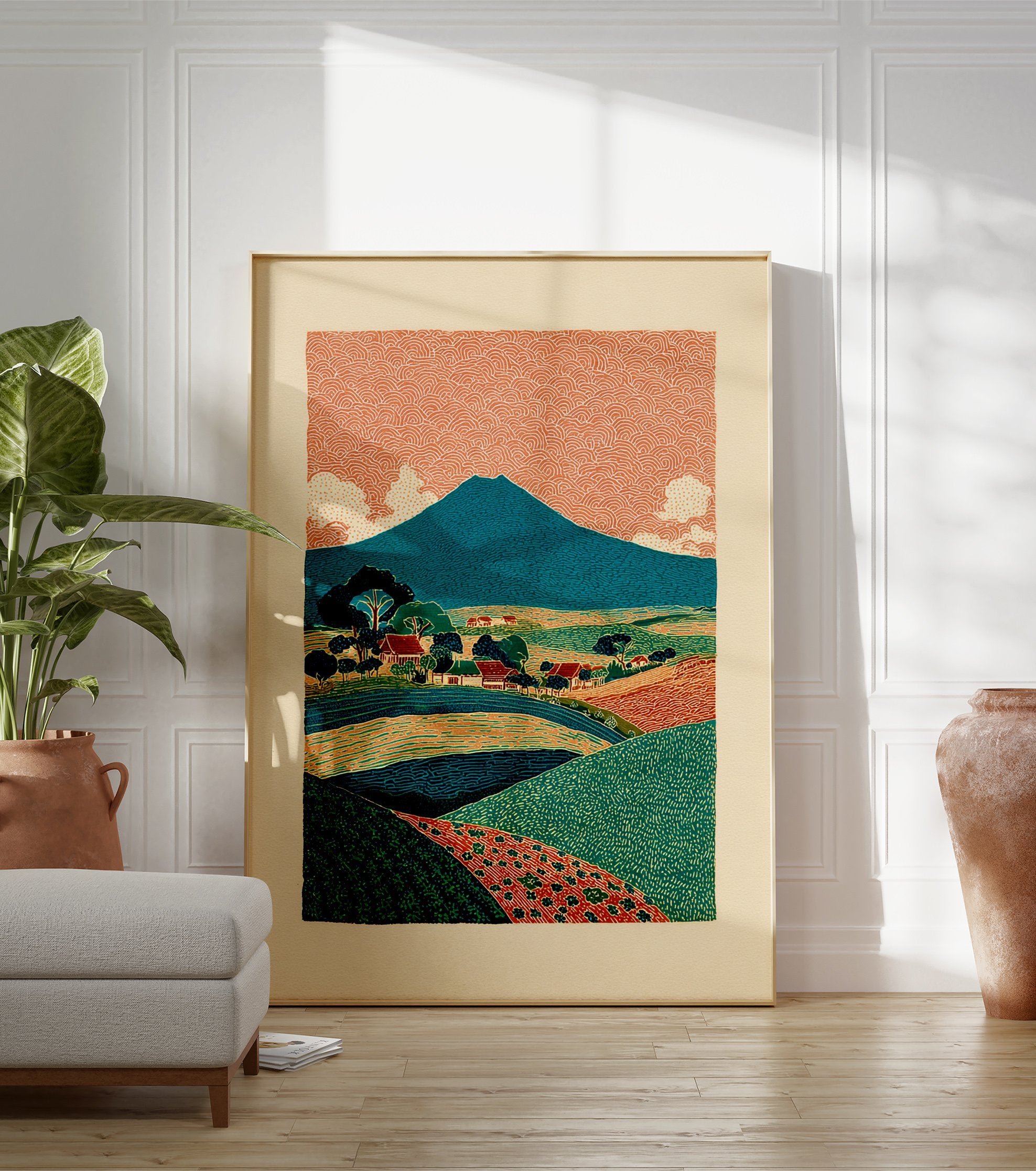 Illustrative landscape poster depicting a blue mountain, orange patterned sky, green fields, and a small village. - Image 3