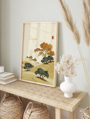 Asian-style landscape wall art print with rolling golden hills, vibrant orange and green trees, birds, and a traditional red seal. - Image 3