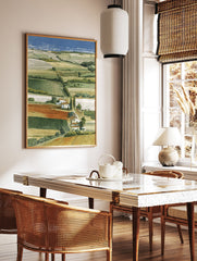 Illustrated landscape art print showing rolling green and yellow fields, white houses, cypress trees, and a distant blue sea. - Image 2