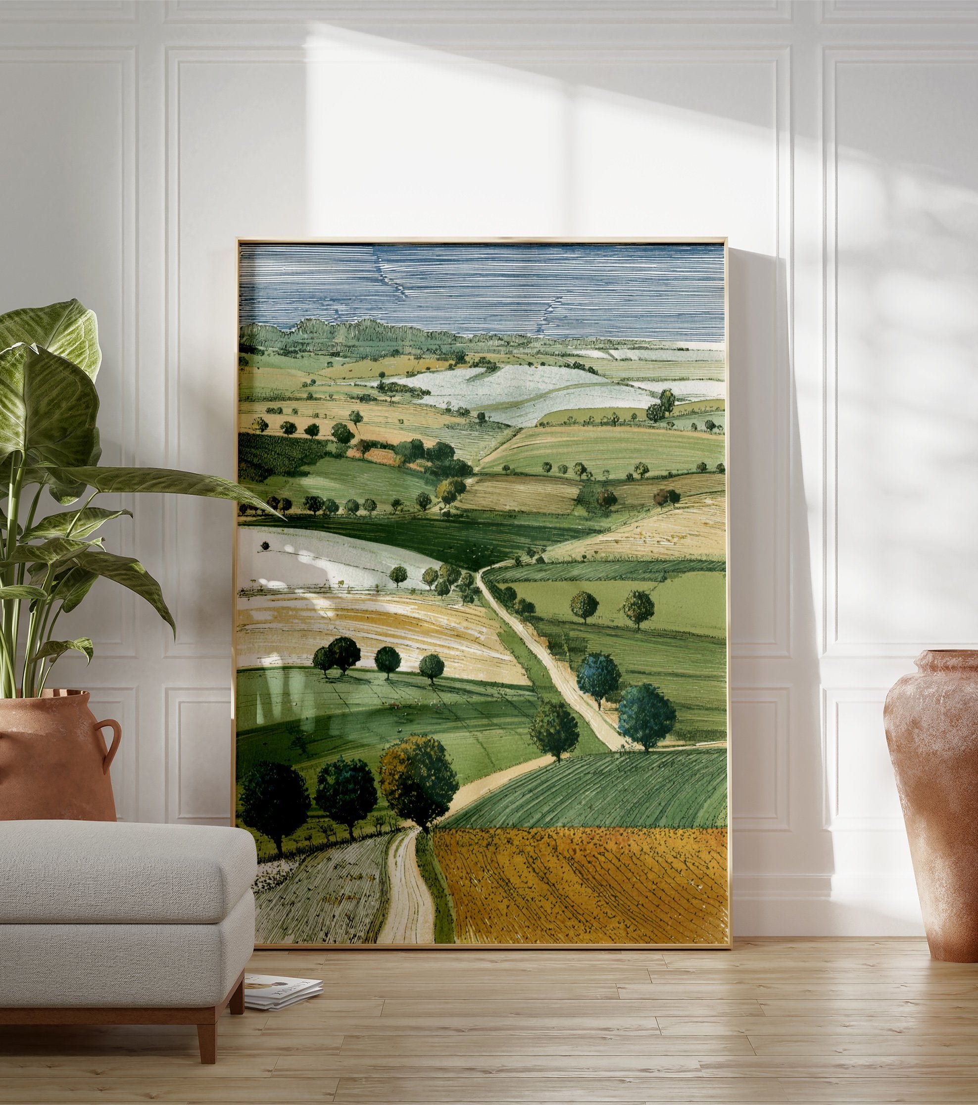 Illustrative landscape wall art print showing green and golden rolling fields, scattered trees, and a winding path under a striped blue sky. - Image 3