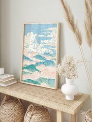 Illustrative landscape wall art print of mountains and clouds in pastel blue, green, and pink, featuring detailed line work. - Image 3
