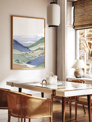 Illustrative landscape wall art print featuring blue and green rolling hills, trees, and white clouds. - Image 2