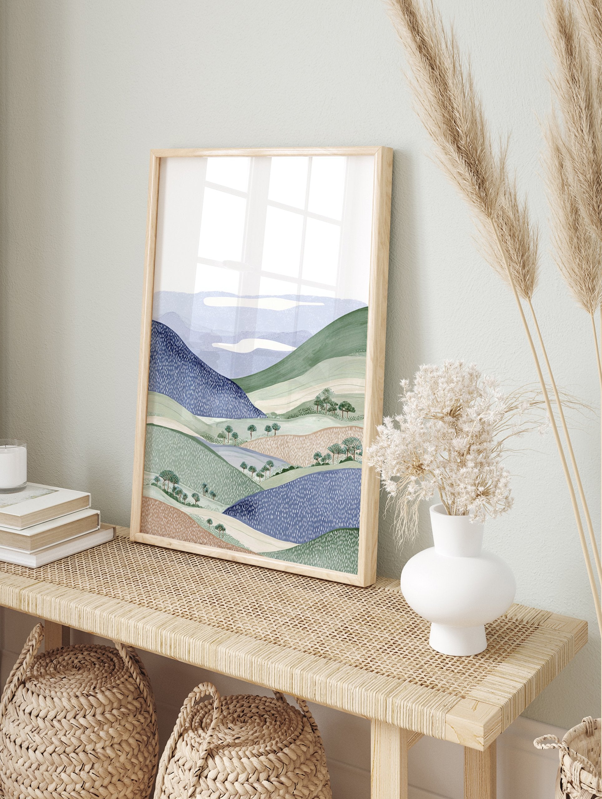 Illustrative landscape wall art print featuring blue and green rolling hills, trees, and white clouds. - Image 3