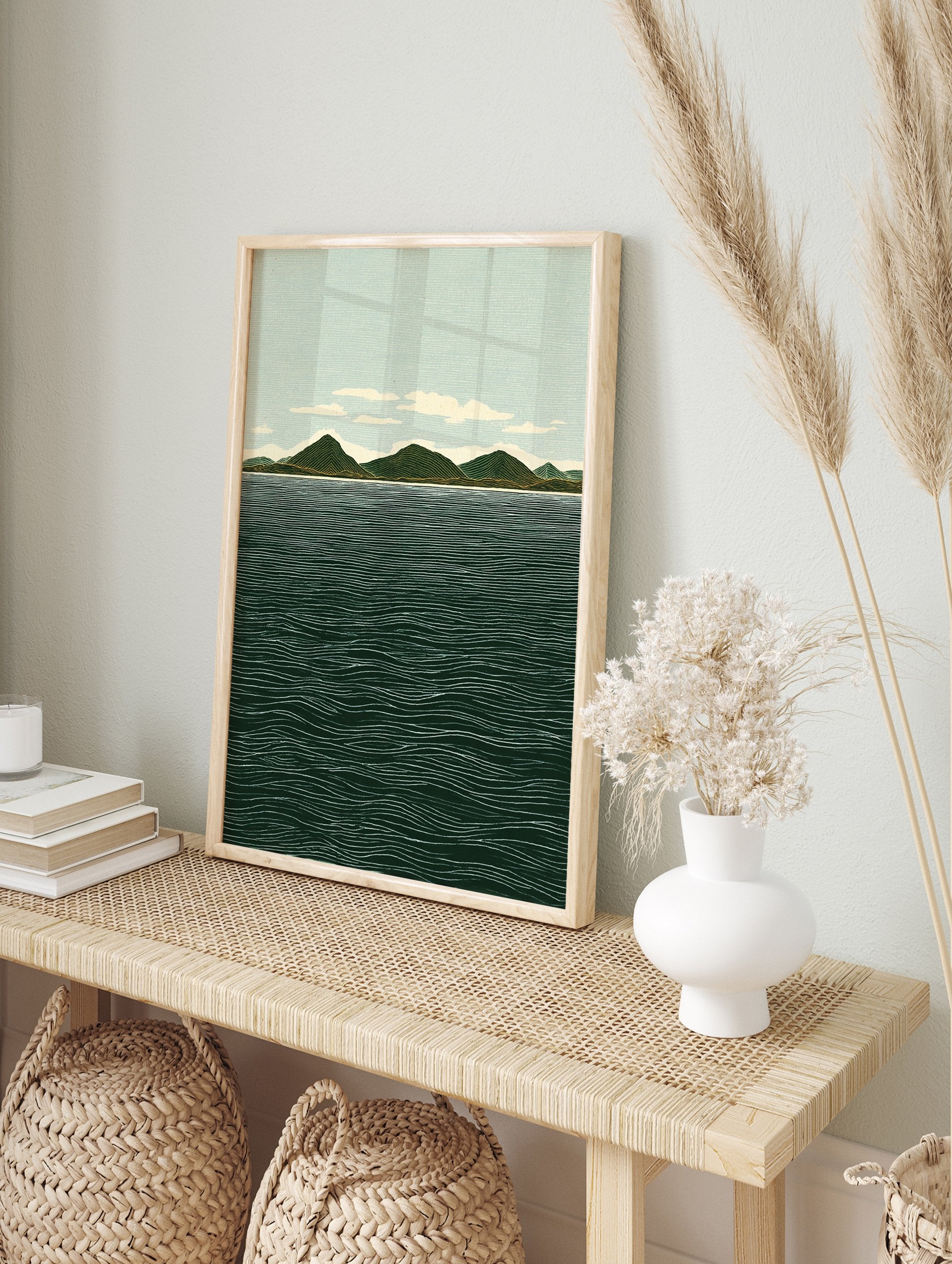 Illustrative landscape wall art print showing green mountains, a light blue sky with clouds, and a dark blue ocean with white waves. - Image 3