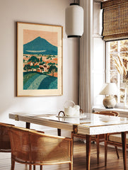 Illustrative landscape art print of a mountain, village, and fields with trees, in teal, orange, and cream colors. - Image 2
