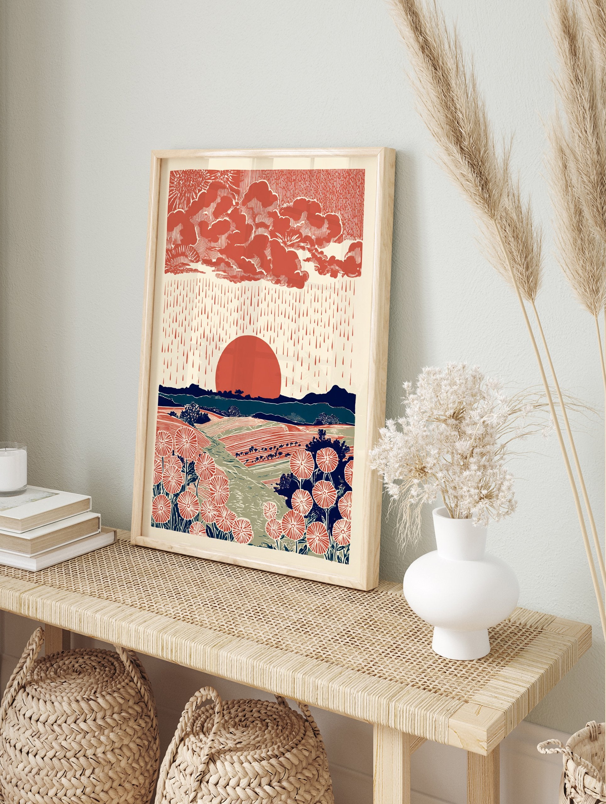 Illustrative landscape wall art with red sun, rain, clouds, mountains, and stylized red flowers in fields. - Image 3
