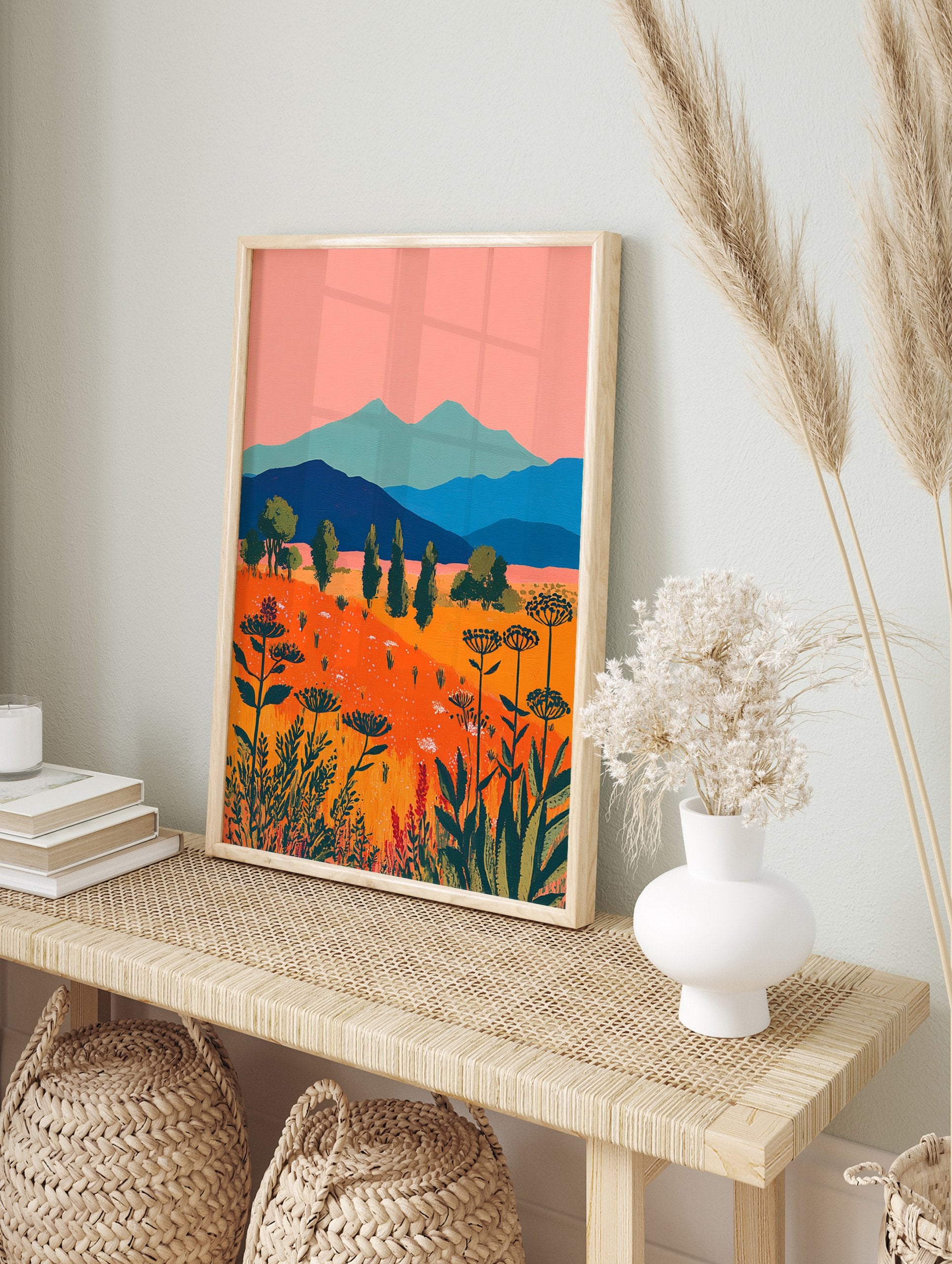 Vibrant illustrative landscape wall art with an orange wildflower field, blue mountains, pink sky, and green trees. - Image 3