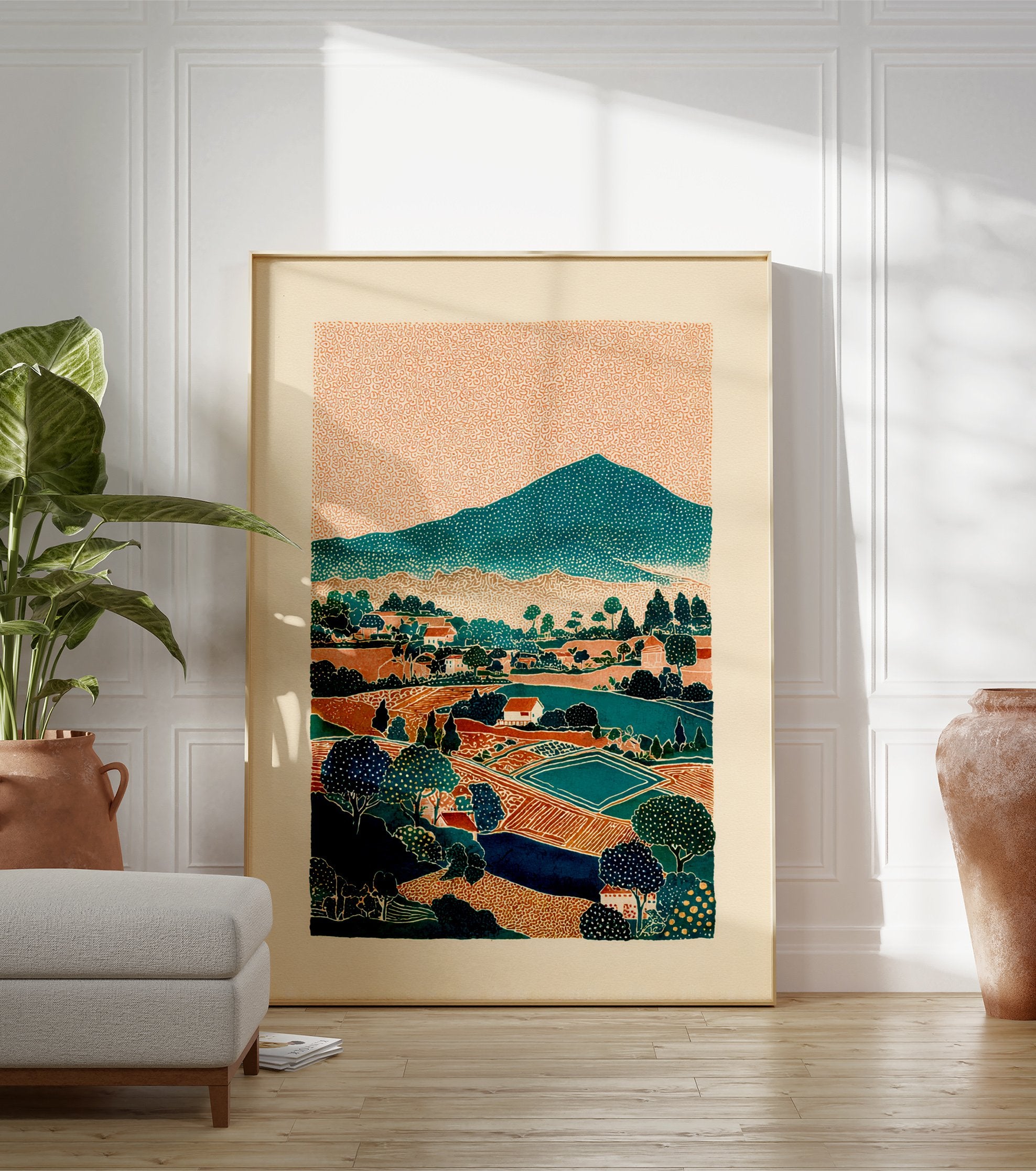 Stylized landscape wall art print depicting a mountain village with fields, trees, and houses under an orange textured sky. - Image 3