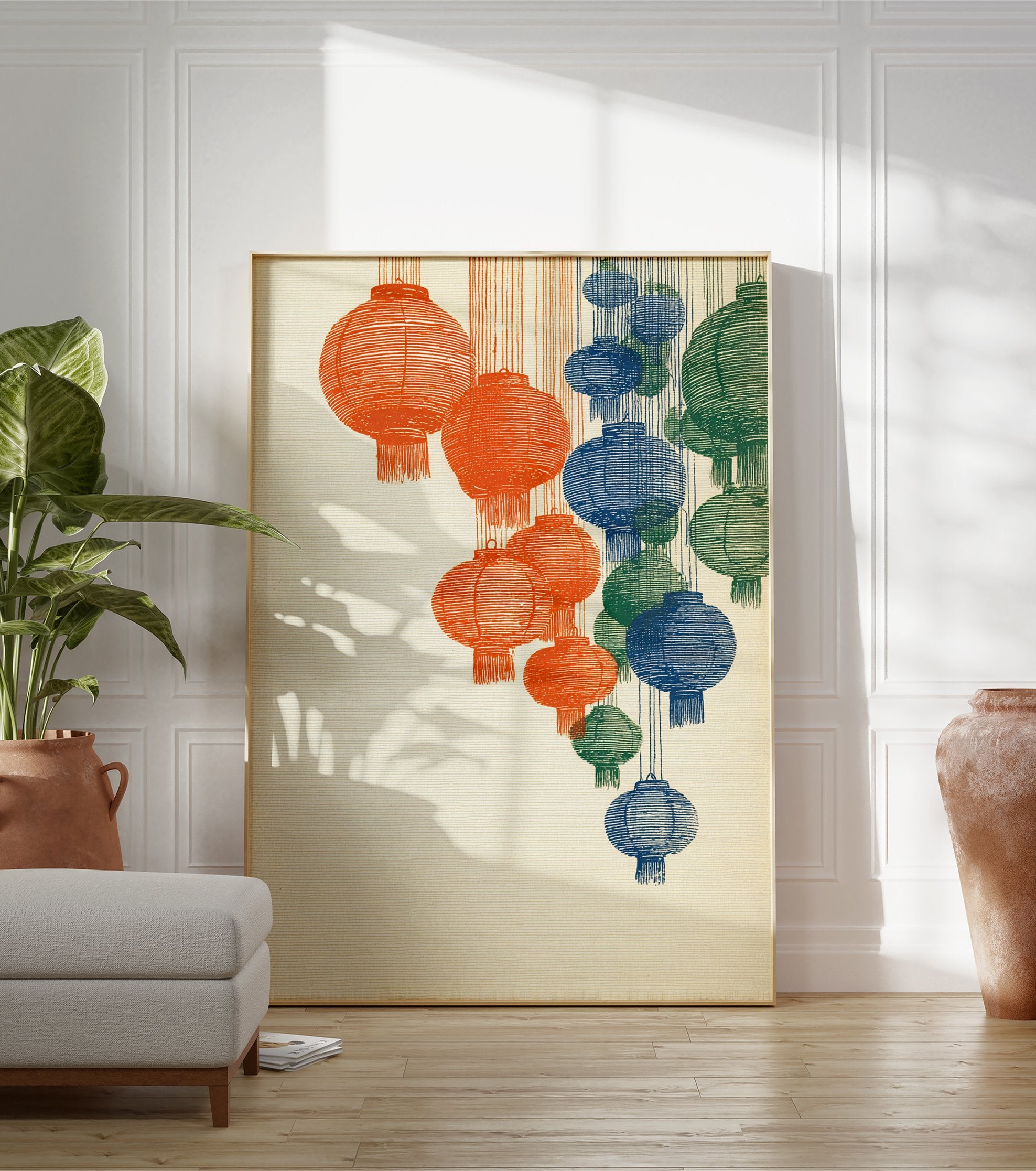 Illustrated wall art print featuring multiple hanging lanterns in orange, blue, and green colors on a textured beige background. - Image 3