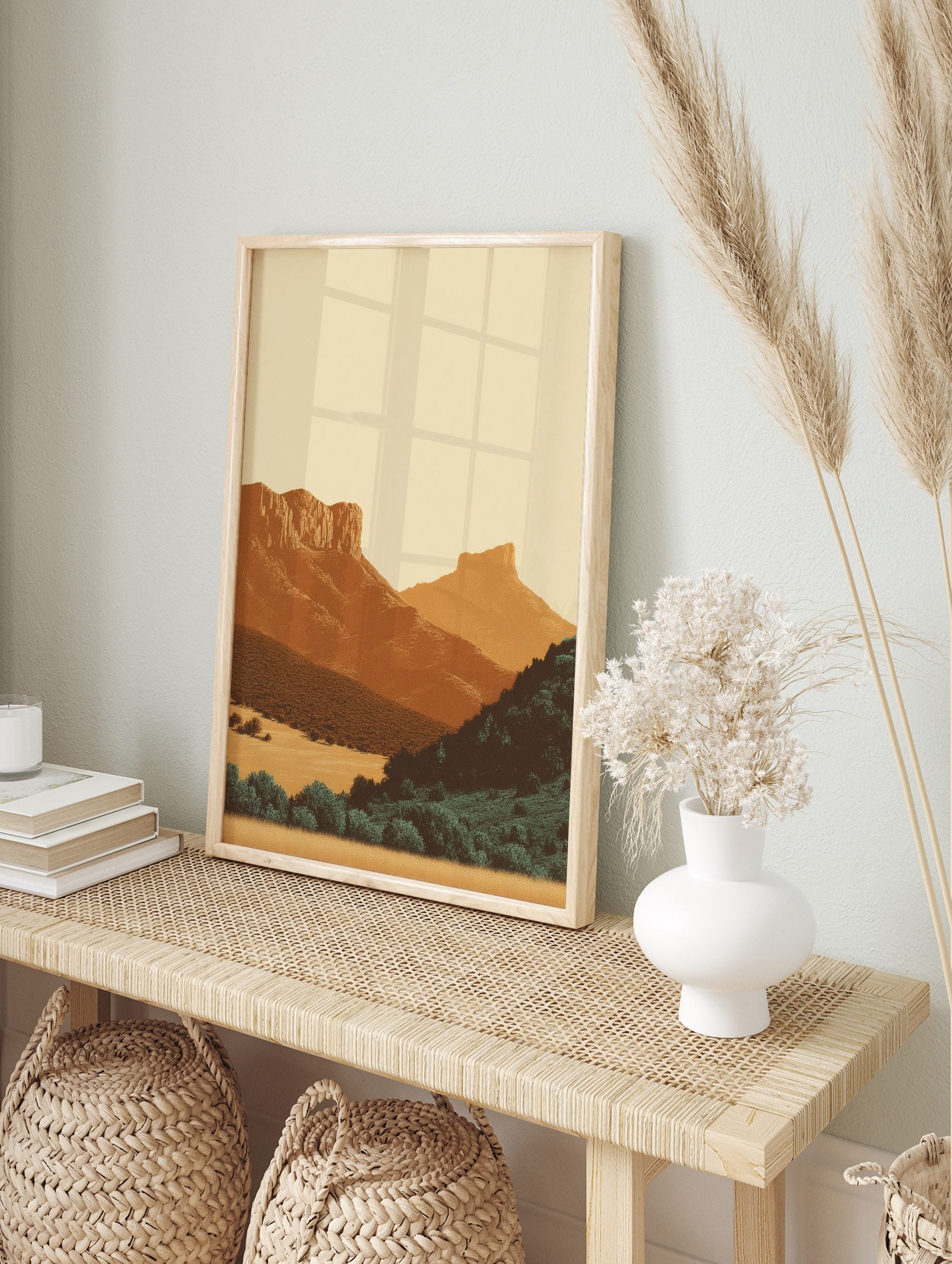 Minimalist illustrative art print of a layered desert mountain landscape with warm earth, in an alternate framed mockup