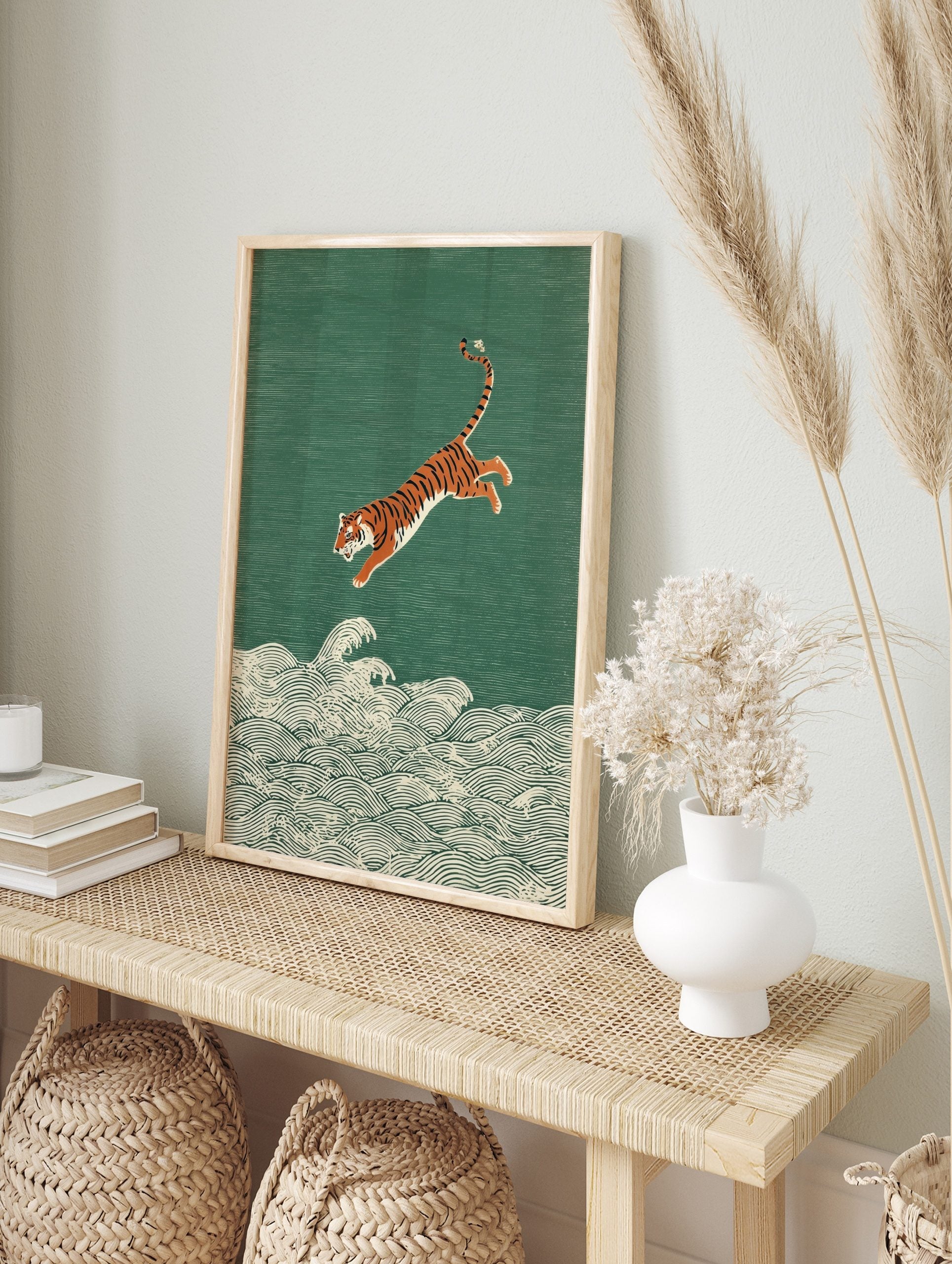 Illustrative print of an orange and black tiger leaping over white ocean waves on a textured, in an alternate framed mockup