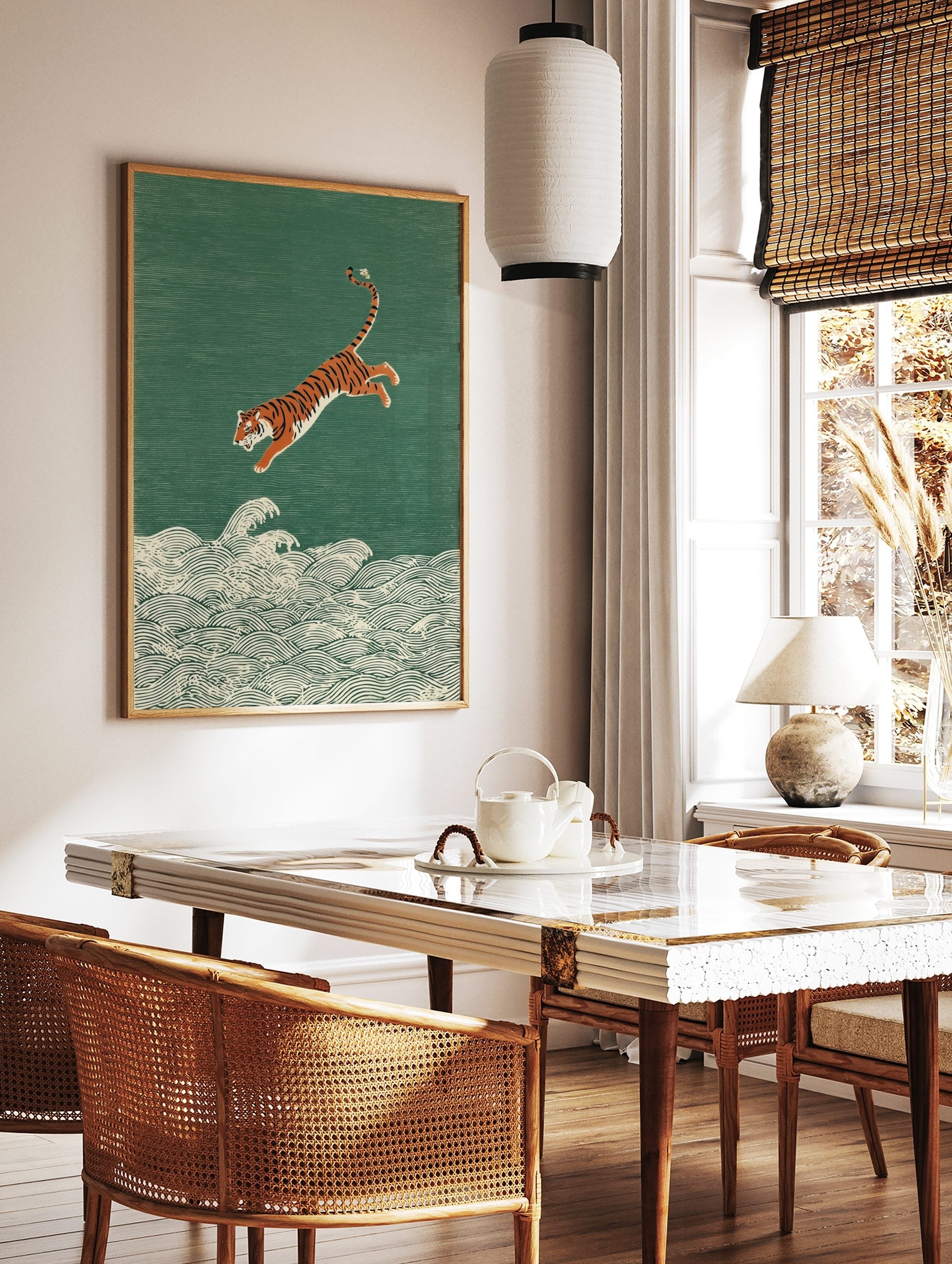 Illustrative print of an orange and black tiger leaping over white ocean waves on a textured green, in a styled room mockup