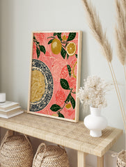 Illustrative lemon and spaghetti wall art print with green leaves on a red striped background, in an alternate framed mockup