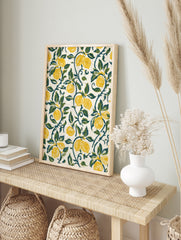 Lemon botanical art print featuring yellow fruit and green vines on an off-white background, in an alternate framed mockup