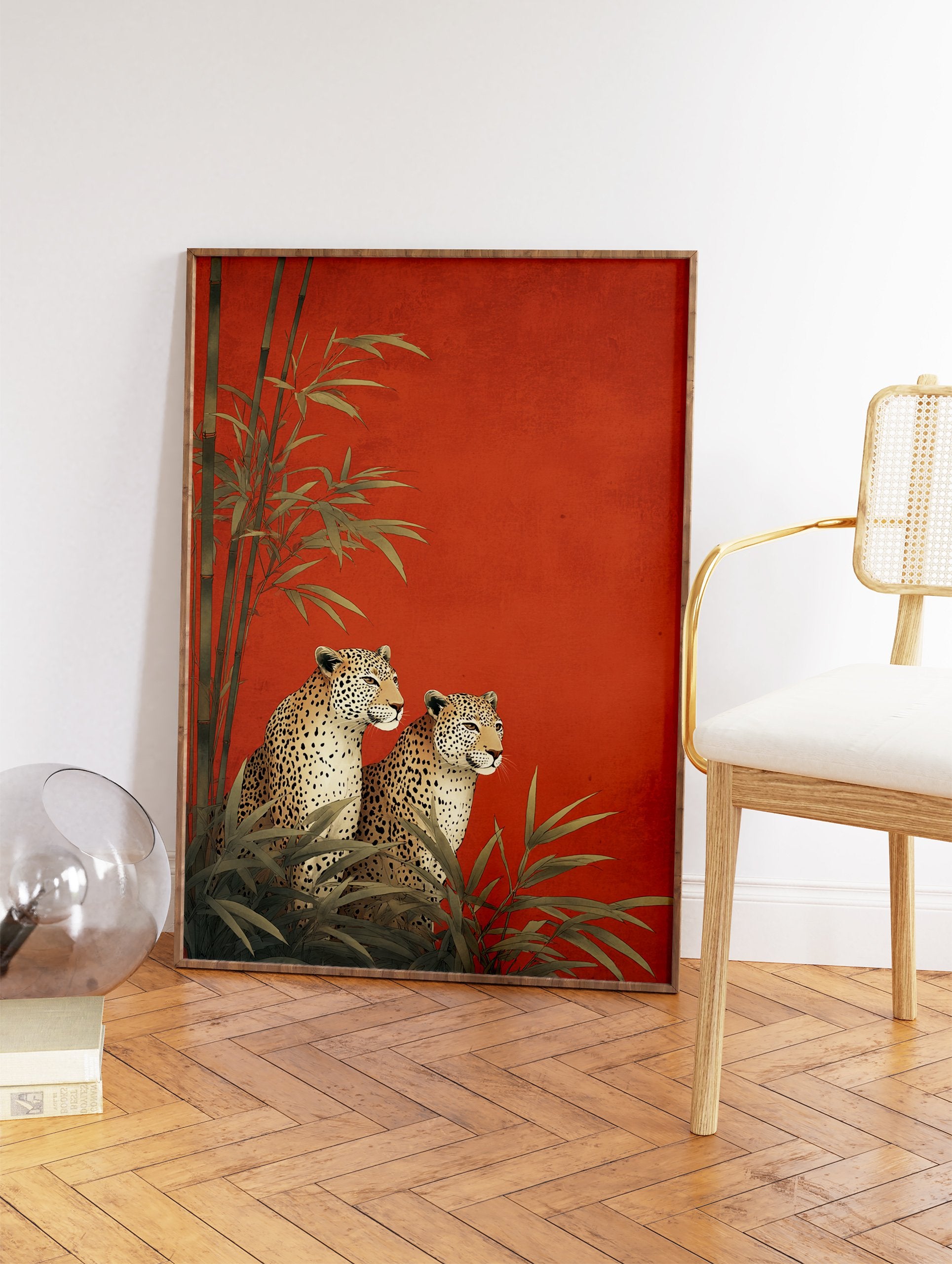 Two illustrative leopards sitting among green bamboo plants against a vibrant textured red background, an elegant Leopard Wall Art print. - Image 2