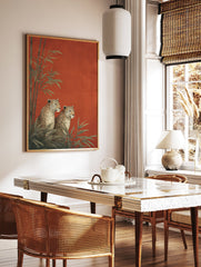 Two illustrative leopards sitting among green bamboo plants against a vibrant textured red background, an elegant Leopard Wall Art print. - Image 3