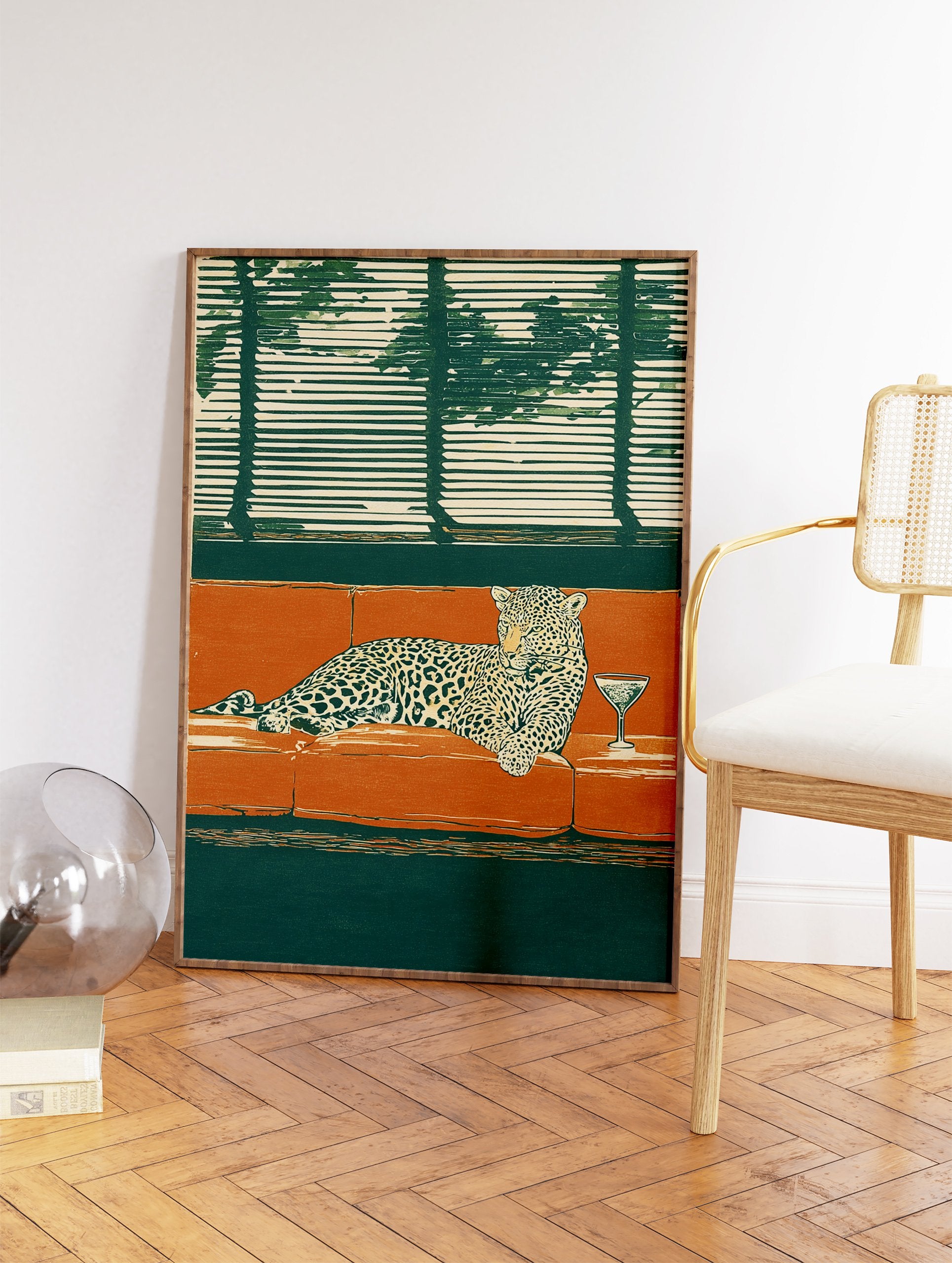 Illustrated leopard lounging on an orange couch with a martini glass, dark green background and window blinds. - Image 2