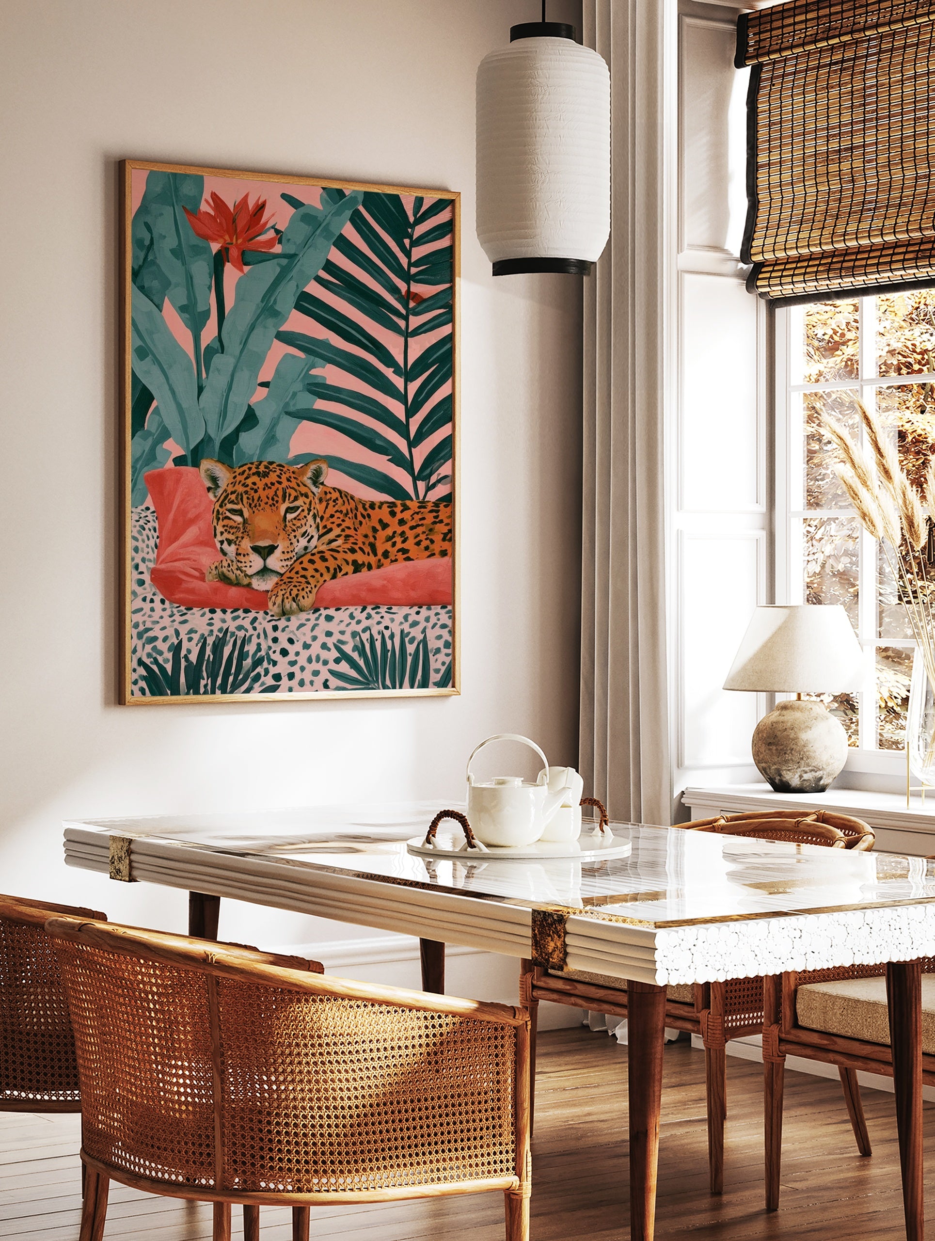 Leopard resting on a red cushion with tropical foliage and a pink background art print, in a styled room mockup