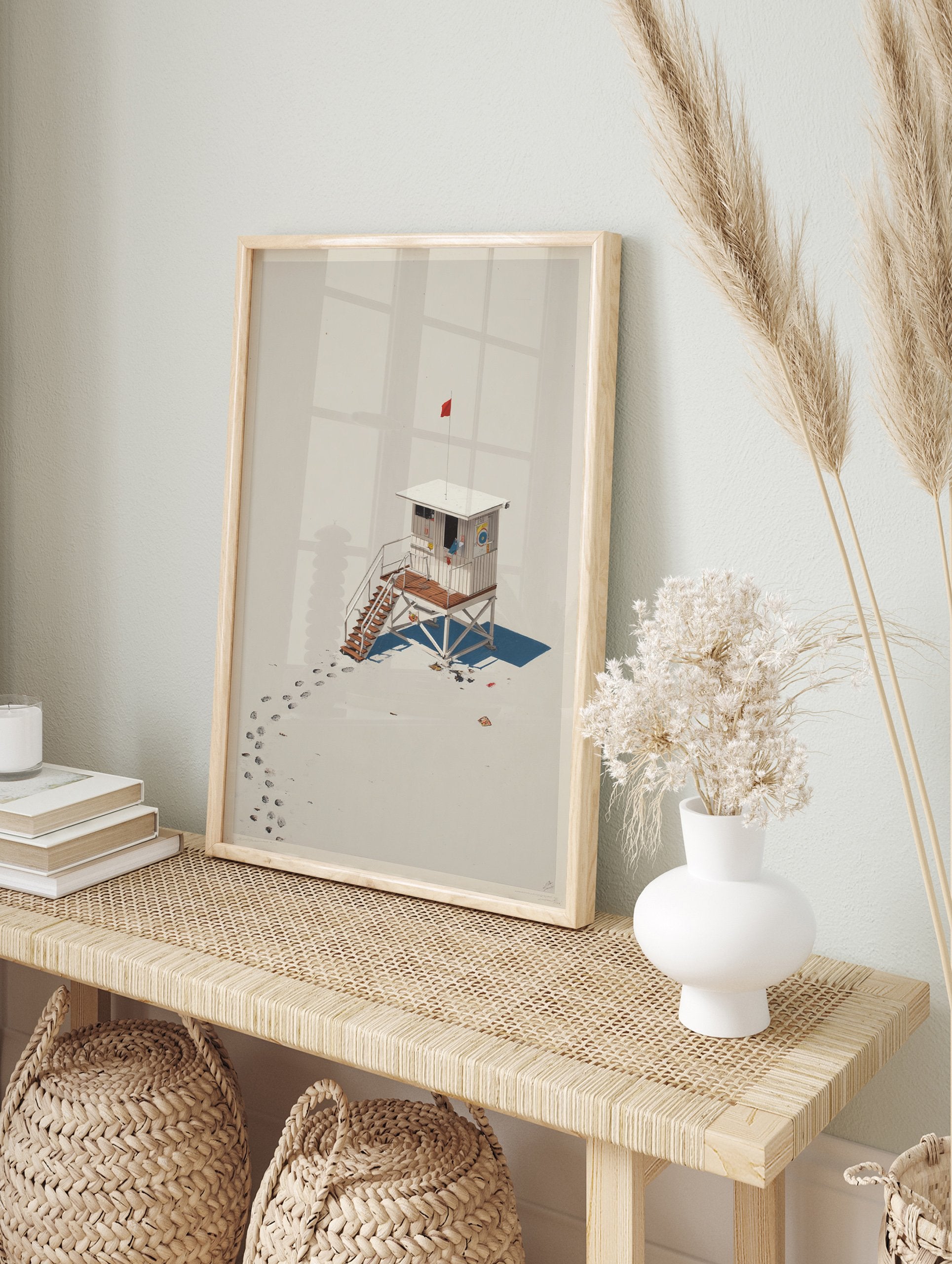 Lifeguard Hut Poster featuring a white hut with a red flag on a beige beach with footprints and shadows. - Image 4