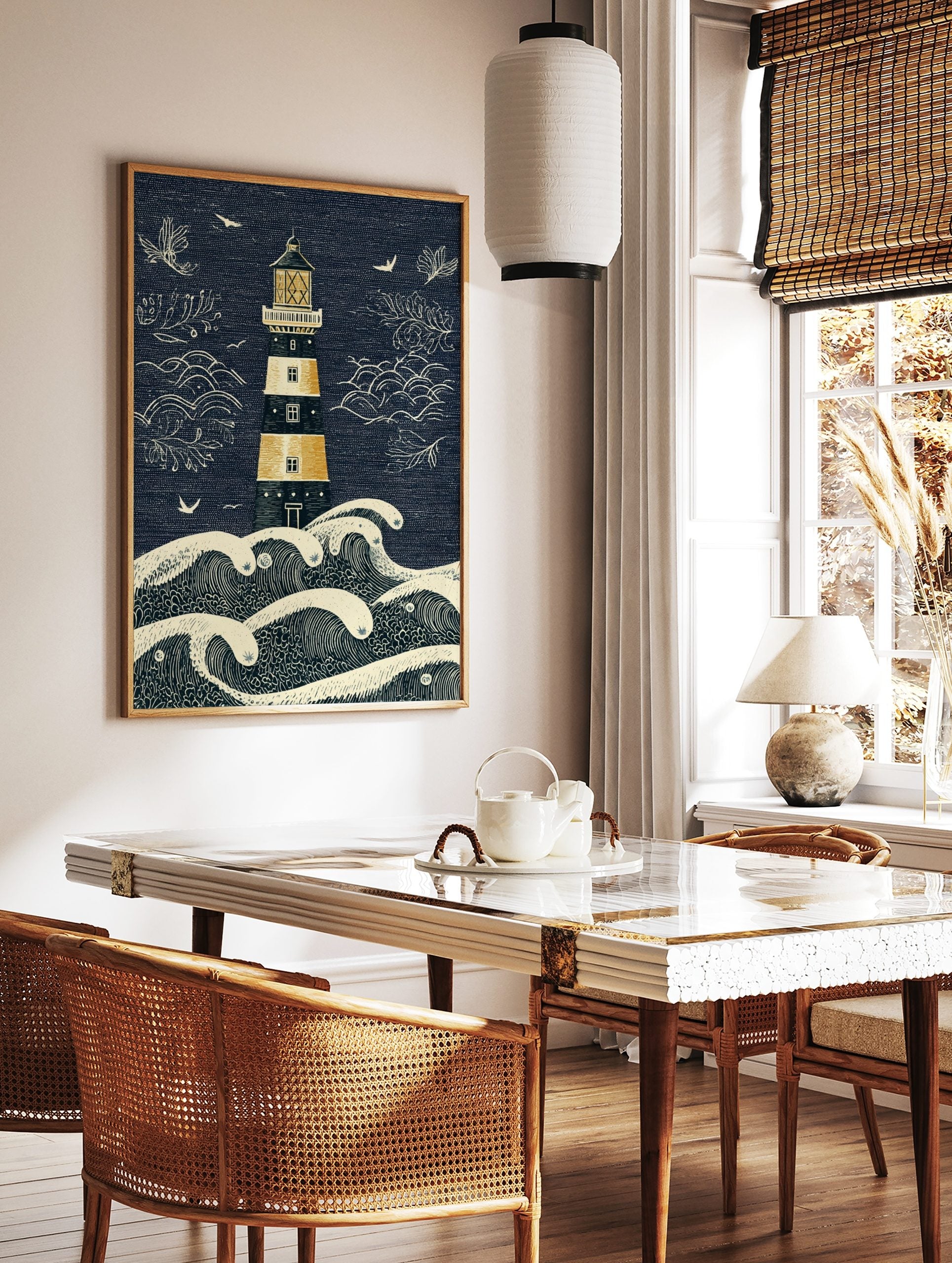 Illustrative lighthouse and crashing waves art print in navy blue, golden yellow, and beige with, in a styled room mockup