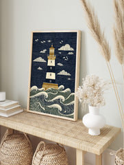 Illustrative lighthouse art print with navy and cream stripes, golden details, and crashing, in an alternate framed mockup