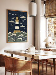 Illustrative lighthouse art print with navy and cream stripes, golden details, and crashing ocean, in a styled room mockup