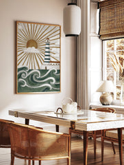 Illustrative lighthouse wall art with green and white stripes, golden sunburst, white clouds, and, in a styled room mockup