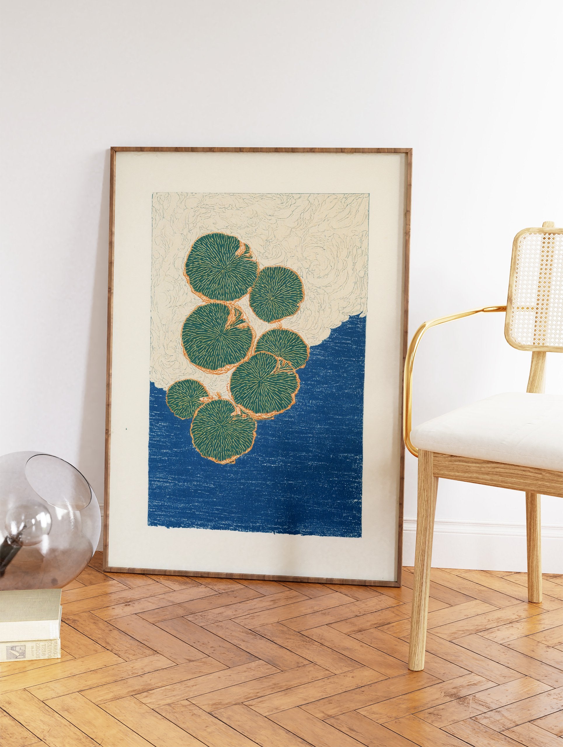 Modern botanical lily pad art print featuring green lily pads with orange outlines floating on a deep blue water background. - Image 2