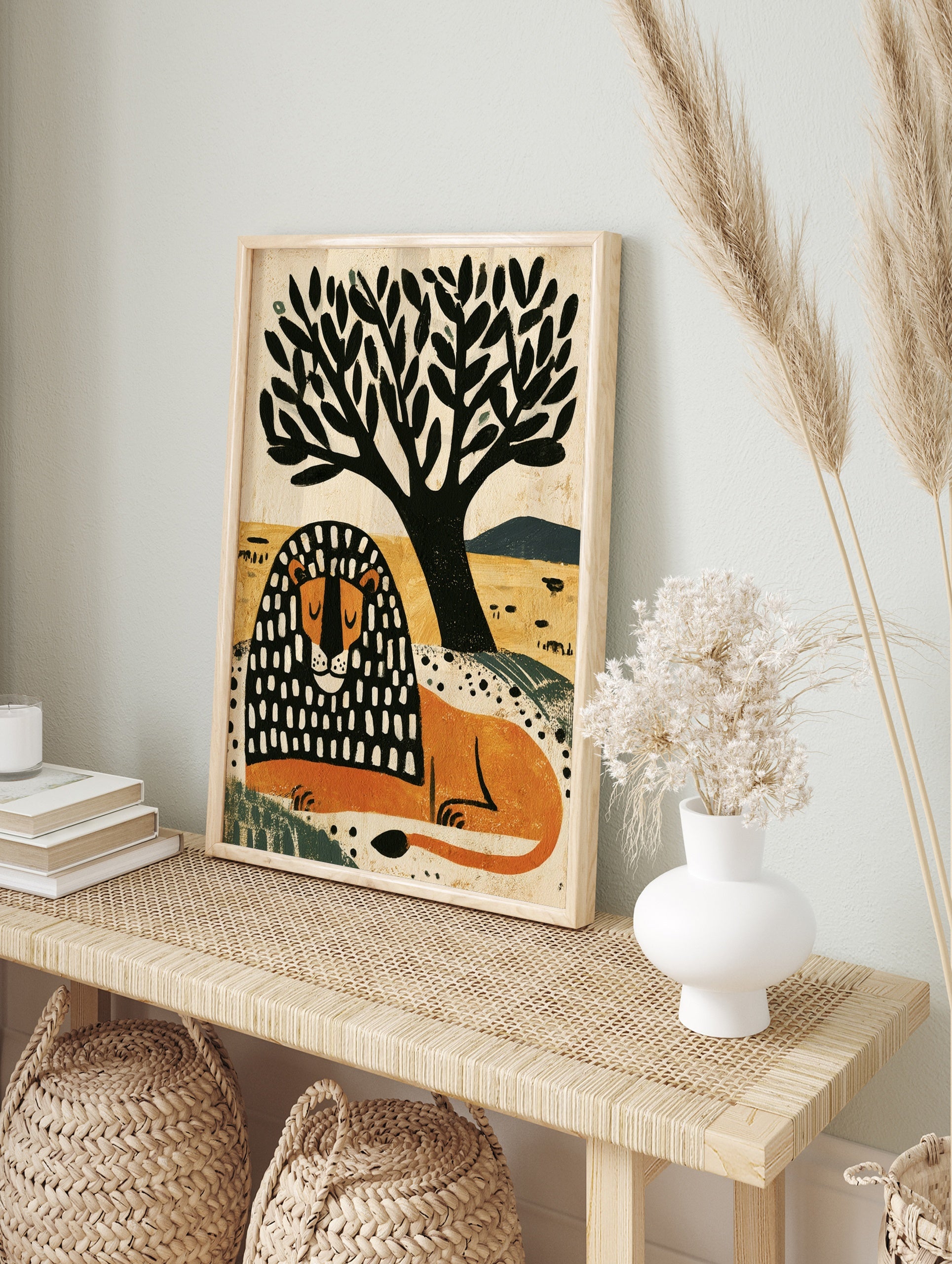 Illustrative lion with black and white patterned mane resting under a tree on a yellow, in an alternate framed mockup