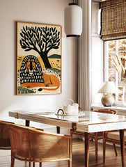 Illustrative lion with black and white patterned mane resting under a tree on a yellow background, in a styled room mockup