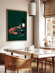 Illustrative print of a red-orange lobster, black mouse, wine bottle, and glasses on a dark green, in a styled room mockup
