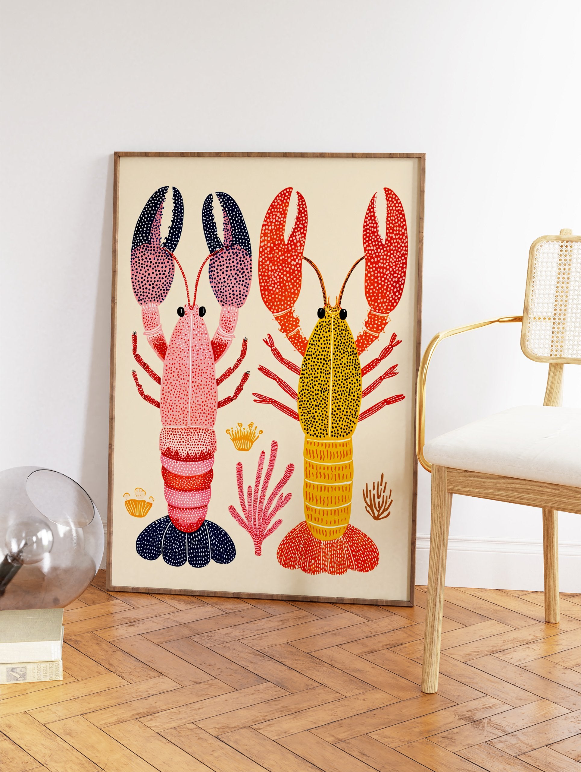 Colorful lobster wall art print featuring a pink and a yellow lobster with patterned claws and bodies, surrounded by coral. - Image 2