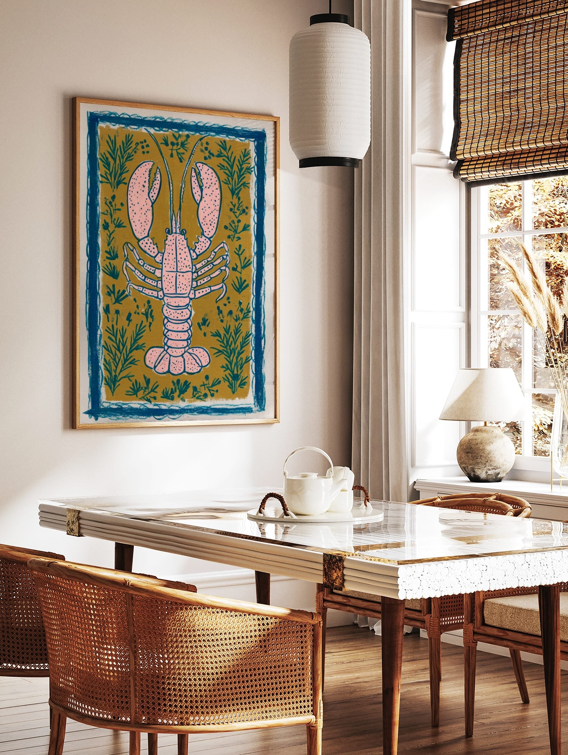 Pink lobster illustration art print on mustard yellow background with teal plants and blue, in a styled room mockup